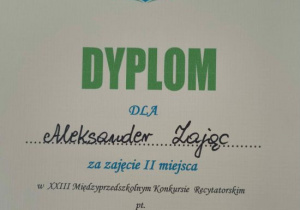 Dyplom Olka za zajęcie II-go miejsca w konkursie recytatorskim.