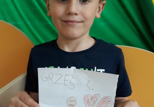 Marcel z portretem Grzesia